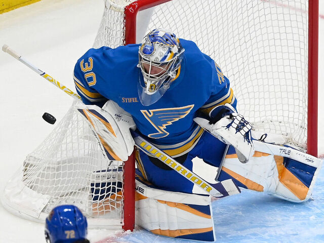ST. LOUIS, MO - MARCH 22: Joel Hofer #30 of the St. Louis Blues blocks a shot againt the Chicago Blackhawks on March 22, 2025 at the Enterprise Center in St. Louis, Missouri.