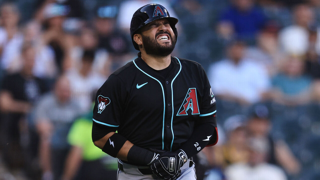 CHICAGO, ILLINOIS - JUNE 23: Eugenio Suárez #28 of the Arizona Diamondbacks is hit by a pitch during the first inning against the Chicago White Sox at Rate Field on June 23, 2025 in Chicago, Illinois.