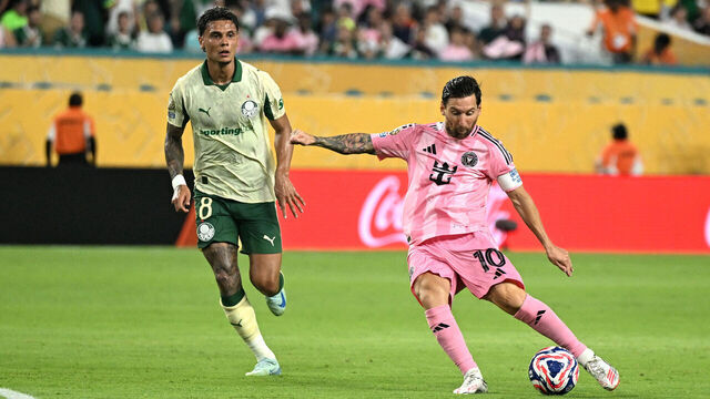 Palmeiras' Colombian midfielder #08 Richard Rios fights for the ball with Inter Miami's Argentine forward #10 Lionel Messi as he shoots but fails to score during the FIFA Club World Cup 2025 Group A football match between US Inter Miami and Brazil's Palmeiras at the Hard Rock stadium in Miami on June 23, 2025.