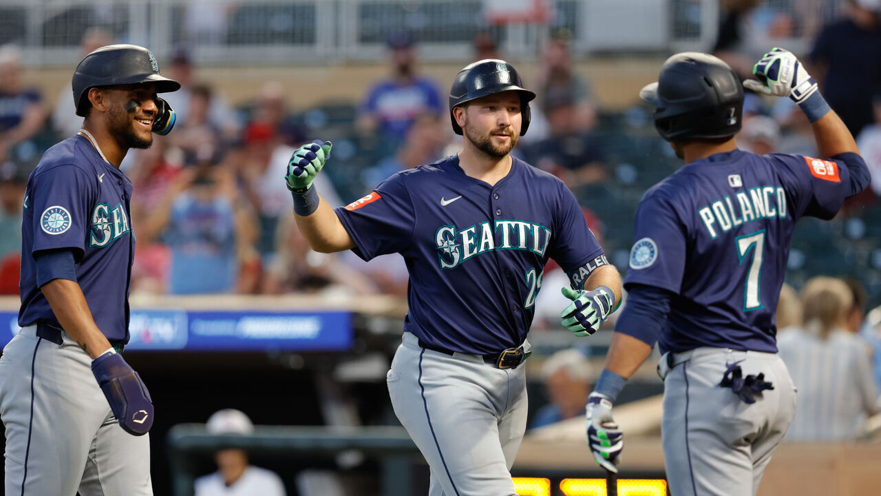 MINNEAPOLIS, MN - JUNE 23: Seattle Mariners catcher Cal Raleigh (29) celebrates with center fielder Julio Rodríguez (44) and designated hitter Jorge Polanco (7) after hitting a two run home run during the ninth inning of an MLB game between the Seattle Mariners and Minnesota Twins on June 23rd, 2025, at Target Field in Minneapolis, MN.