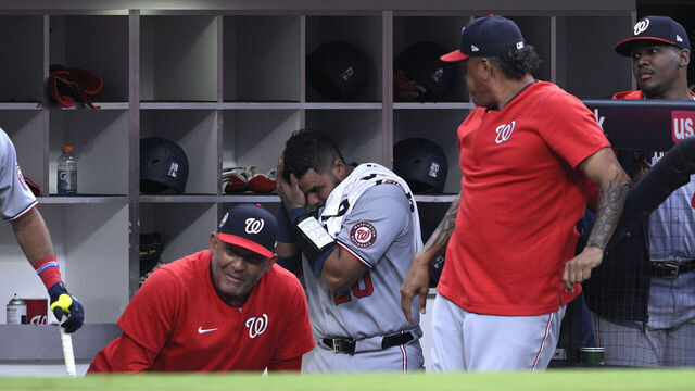 SAN DIEGO, CALIFORNIA - JUNE 23: Keibert Ruiz #20 of the Washington Nationals leaves the dugout after being hit by a foul ball during the fourth inning against the San Diego Padres at Petco Park on June 23, 2025 in San Diego, California.