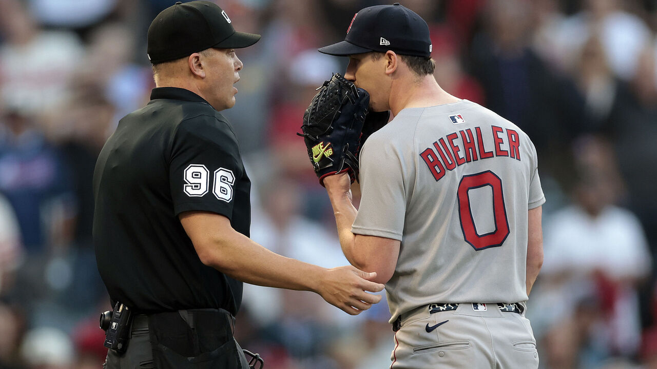 ANAHEIM, CALIFORNIA - JUNE 23: Umpire Chris Segal #96 talks with Walker Buehler #0 of the Boston Red Sox after Zach Neto #9 of the Los Angeles Angels was hit by a pitch in the first inning at Angel Stadium of Anaheim on June 23, 2025 in Anaheim, California.