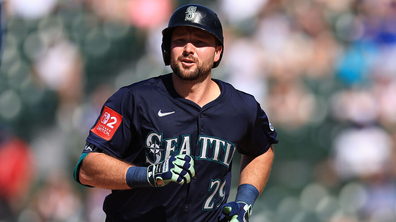 CHICAGO, ILLINOIS - JUNE 21: Cal Raleigh #29 of the Seattle Mariners celebrates hitting a home run against the Chicago Cubs at Wrigley Field on June 21, 2025 in Chicago, Illinois.