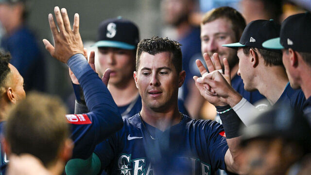 MINNEAPOLIS, MINNESOTA - JUNE 24: Dylan Moore #25 of the Seattle Mariners celebrates after scoring a go-ahead run against the Minnesota Twins in the ninth inning of the game at Target Field on June 24, 2025 in Minneapolis, Minnesota.