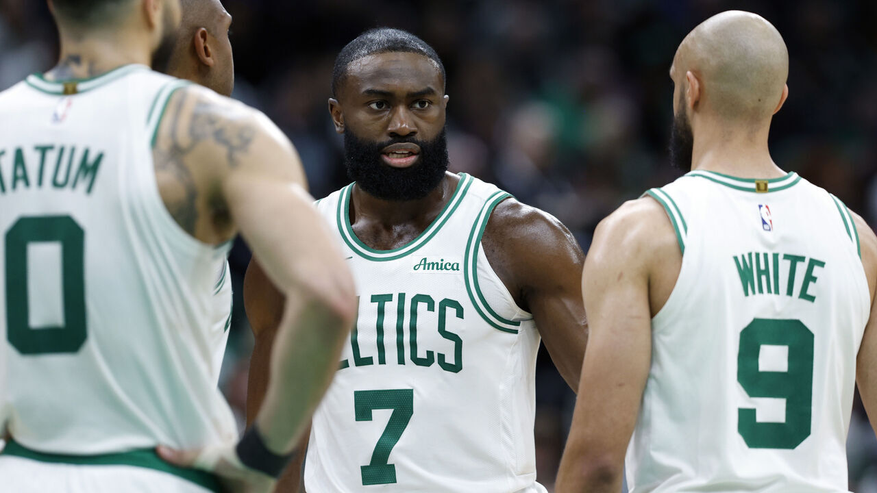 Boston, MA - May 5: Boston Celtics forward Jayson Tatum (0), center Al Horford, guard Jaylen Brown and guard Derrick White talk in the fourth quarter of Game 1 of the NBA Eastern Conference semifinal at TD Garden.