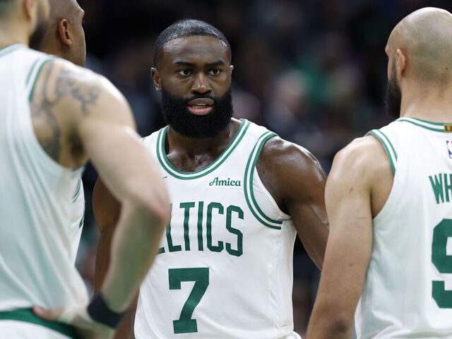 Boston, MA - May 5: Boston Celtics forward Jayson Tatum (0), center Al Horford, guard Jaylen Brown and guard Derrick White talk in the fourth quarter of Game 1 of the NBA Eastern Conference semifinal at TD Garden.