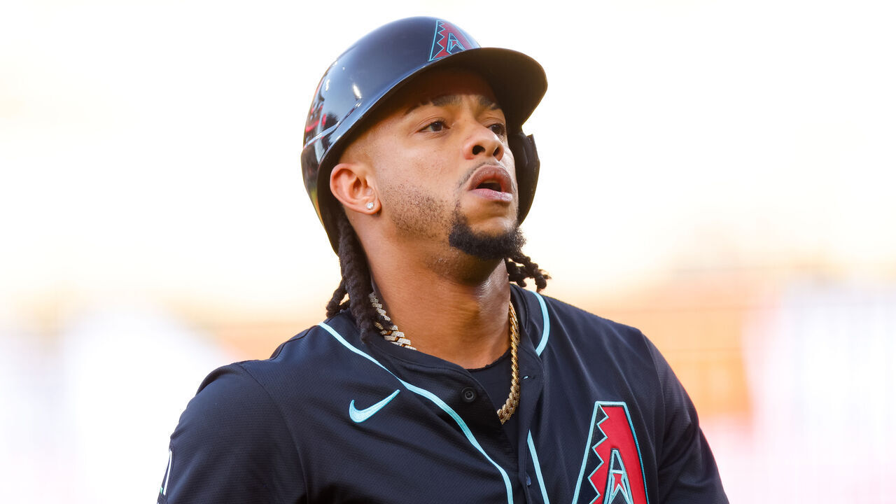 DENVER, CO - JUNE 21: Ketel Marte #4 of the Arizona Diamondbacks walks off the field in the second inning against the Colorado Rockies at Coors Field on June 21, 2025 in Denver, Colorado.