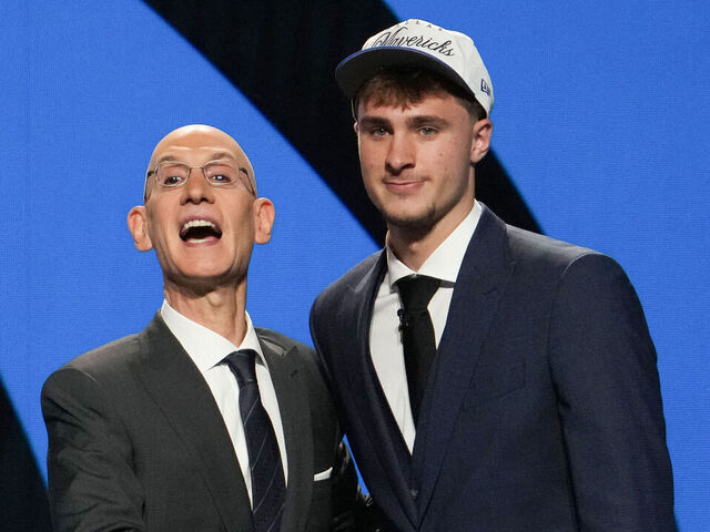 US basketball player Cooper Flagg (R) shakes hands with NBA Commissioner Adam Silver after being selected first overall by the Dallas Mavericks during the opening round of the 2025 NBA Draft at Barclays Center in Brooklyn, New York, on June 25, 2025. Versatile US college teen star Cooper Flagg was selected first overall in the NBA draft on June 25 by the Dallas Mavericks, where he'll join a star-laden team already touted as a playoff threat next season. Flagg, a consensus pick as the top US college player as a freshman at Duke University last season, is the second-youngest player taken first overall.