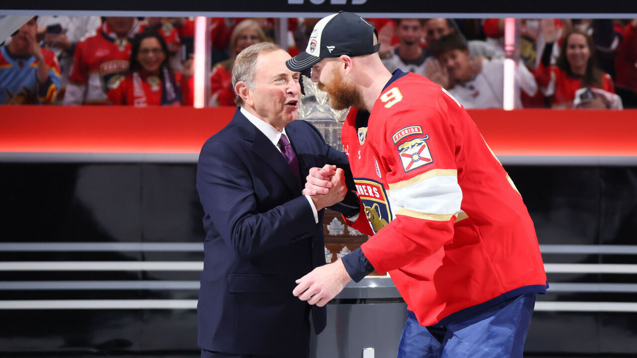 SUNRISE, FLORIDA - JUNE 17: NHL commissioner Gary Bettman presents Sam Bennett #9 of the Florida Panthers with the Stanley Cup after the Florida Panthers defeated the Edmonton Oilers in Game Six of the 2025 Stanley Cup Final at Amerant Bank Arena on June 17, 2025 in Sunrise, Florida.