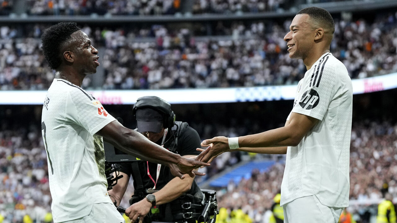 MADRID, SPAIN - MAY 24: Kylian Mbappe' of Real Madrid celebrates his goal with Vinicius Junior of Real Madrid during the LaLiga match between Real Madrid CF and Real Sociedad at Estadio Santiago Bernabeu on May 24, 2025 in Madrid, Spain.