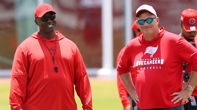 TAMPA, FL - SEP 09: Tampa Bay Buccaneers Head Coach Todd Bowles talks with General Manager Jason Licht during the Tampa Bay Buccaneers Rookie Mini Camp workout on May 09, 2025 at the AdventHealth Training Center in Tampa, Florida.