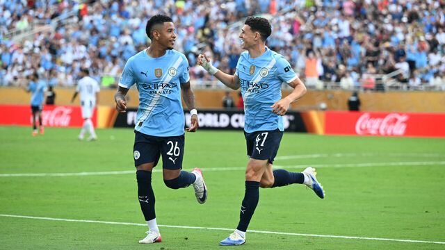 Manchester City's English midfielder #47 Phil Foden (R) celebrates with teammate Brazilian midfielder #26 Savinho after scoring his team's fourth goal during the FIFA Club World Cup 2025 Group D football match between Italy's Juventus and England's Manchester City at the Camping World stadium in Orlando on June 26, 2025.