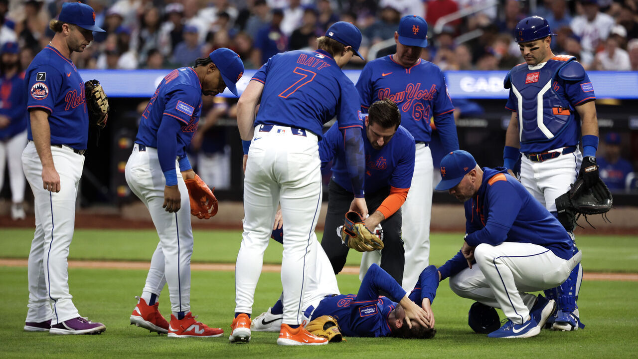 NEW YORK, NEW YORK - JUNE 26: Griffin Canning #46 of the New York Mets puts his hands on his face after an injury in the third inning against the Atlanta Braves at Citi Field on June 26, 2025 in New York City.