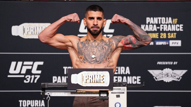 LAS VEGAS, NEVADA - JUNE 27: Ilia Topuria poses on the scale during the UFC 317 official weigh-in at UFC Apex on June 27, 2025 in Las Vegas, Nevada.