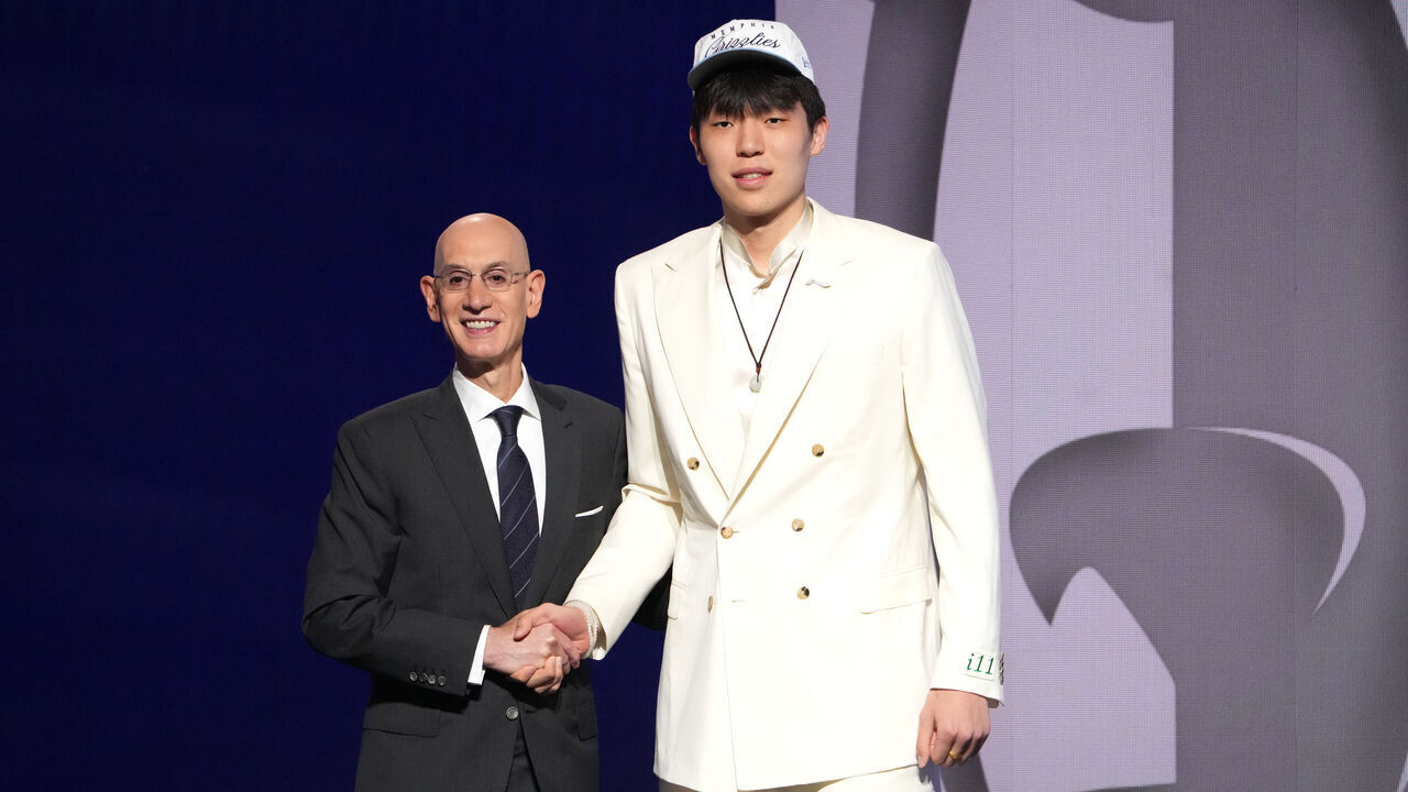BROOKLYN, NY - JUNE 25: Adam Silver poses with Yang Hansen after he was drafted sixteenth overall overall by the Memphis Grizzlies during the 2025 NBA Draft - Round One on June 25, 2025 at Barclays Center in Brooklyn, New York. Mandatory Copyright Notice: Copyright 2025 NBAE