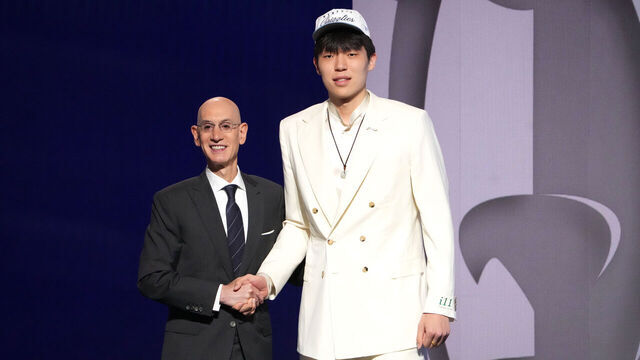 BROOKLYN, NY - JUNE 25: Adam Silver poses with Yang Hansen after he was drafted sixteenth overall overall by the Memphis Grizzlies during the 2025 NBA Draft - Round One on June 25, 2025 at Barclays Center in Brooklyn, New York. Mandatory Copyright Notice: Copyright 2025 NBAE