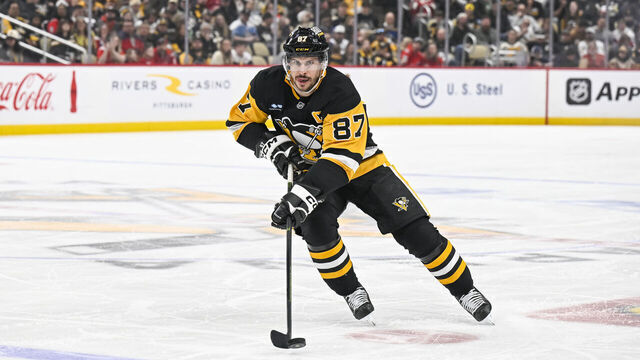 PITTSBURGH, PA - APRIL 17: Pittsburgh Penguins center Sidney Crosby (87) skates with the puck during the second period in the NHL game between the Pittsburgh Penguins and the Washington Capitals on April 17, 2025, at PPG Paints Arena in Pittsburgh, PA.