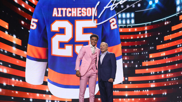 LOS ANGELES, CALIFORNIA - JUNE 27: Kashawn Aitcheson poses with NHL commissioner Gary Bettman after being drafted by the New York Islanders with the 17th overall pick during the first round of the 2025 Upper Deck NHL Draft at the Peacock Theater on June 27, 2025 in Los Angeles, California.