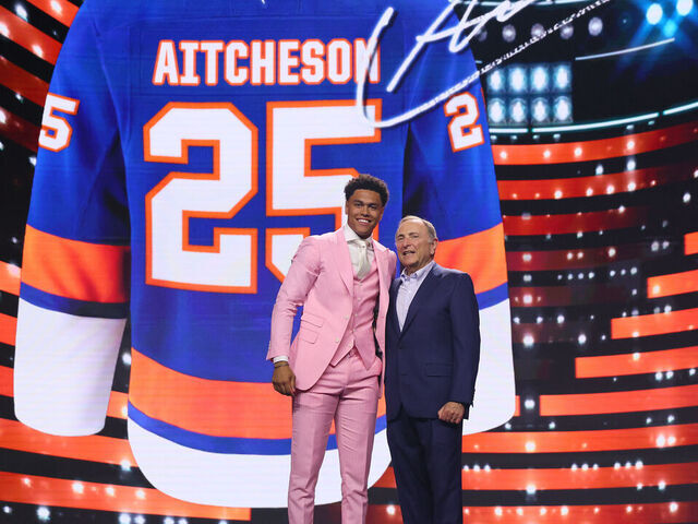LOS ANGELES, CALIFORNIA - JUNE 27: Kashawn Aitcheson poses with NHL commissioner Gary Bettman after being drafted by the New York Islanders with the 17th overall pick during the first round of the 2025 Upper Deck NHL Draft at the Peacock Theater on June 27, 2025 in Los Angeles, California.