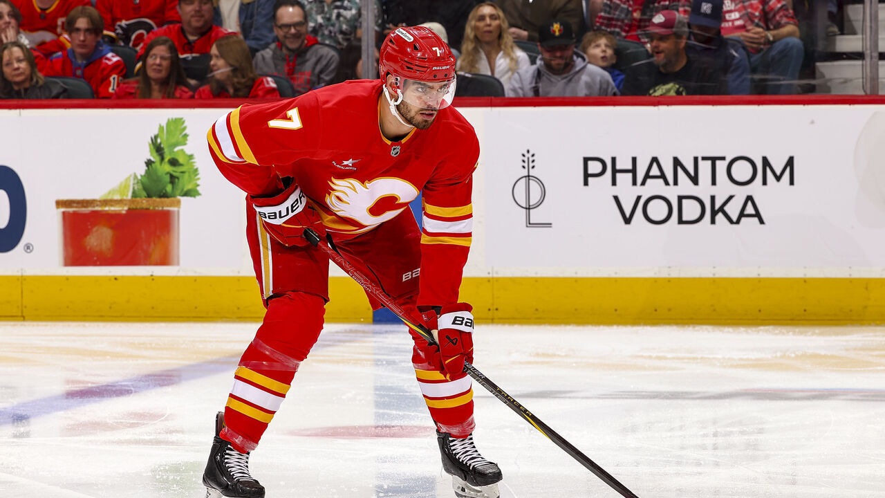 CALGARY, AB - APRIL 11: Kevin Bahl #7 of the Calgary Flames prepares to face off against the Minnesota Wild at Scotiabank Saddledome on April 11, 2025 in Calgary, Alberta, Canada.