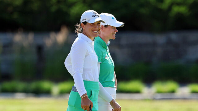 MIDLAND, MICHIGAN - JUNE 28: Albane Valenzuela of Switzerland (L) and Sarah Schmelzel of the United States laugh on the 18th hole during the third round of the Dow Championship 2025 at Midland Country Club on June 28, 2025 in Midland, Michigan.