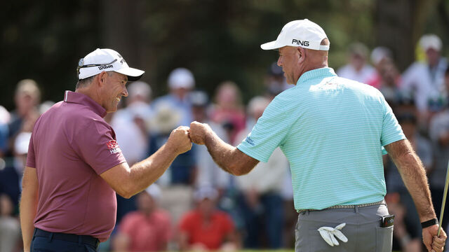 COLORADO SPRINGS, COLORADO - JUNE 28: Padraig Harrington of Ireland and Stewart Cink of the United States fist bump on the 18th green during the third round of the U.S. Senior Open Championship 2025 at Broadmoor Golf Club on June 28, 2025 in Colorado Springs, Colorado.