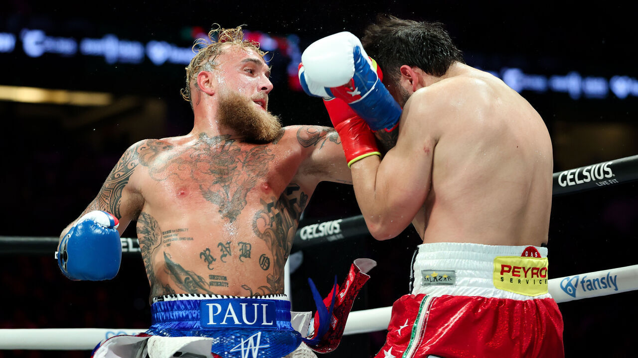 ANAHEIM, CALIFORNIA - JUNE 28: Jake Paul throws a punch at Julio Cesar Chavez Jr during their fight at Honda Center on June 28, 2025 in Anaheim, California.