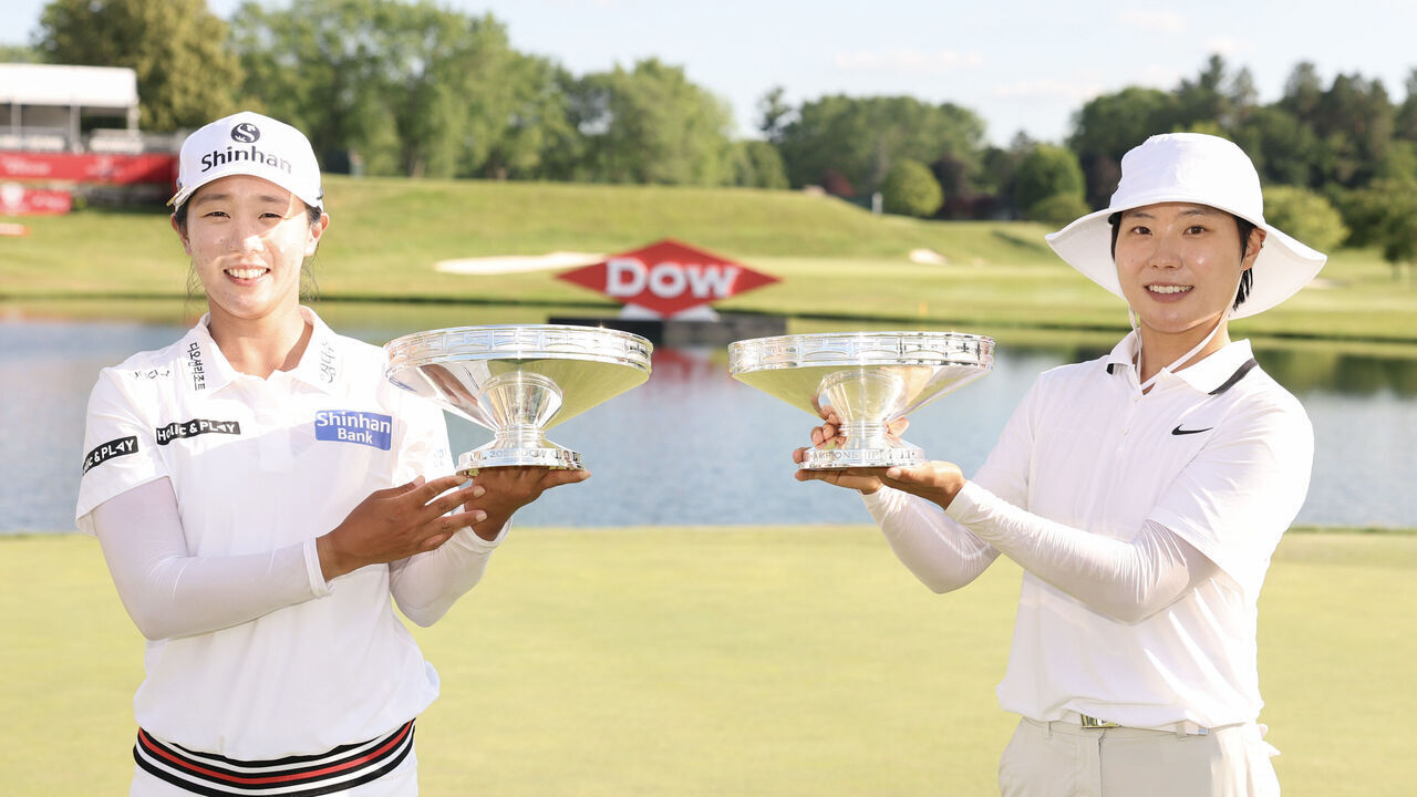 MIDLAND, MICHIGAN - JUNE 29: Jin Hee Im and Somi Lee of South Korea pose with their trophies after the final round of the Dow Championship 2025 at Midland Country Club on June 29, 2025 in Midland, Michigan.