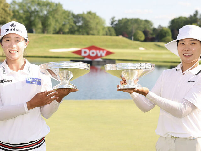 MIDLAND, MICHIGAN - JUNE 29: Jin Hee Im and Somi Lee of South Korea pose with their trophies after the final round of the Dow Championship 2025 at Midland Country Club on June 29, 2025 in Midland, Michigan.