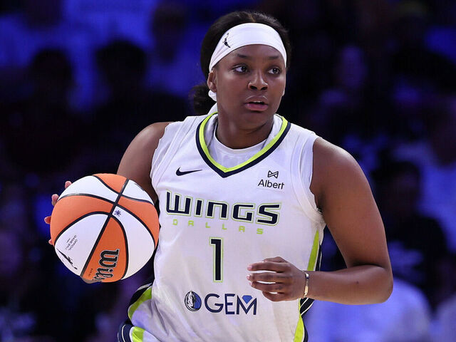 ARLINGTON, TEXAS - JUNE 24: NaLyssa Smith #1 of the Dallas Wings controls the ball during the first half against the Atlanta Dream at College Park Center on June 24, 2025 in Arlington, Texas.
