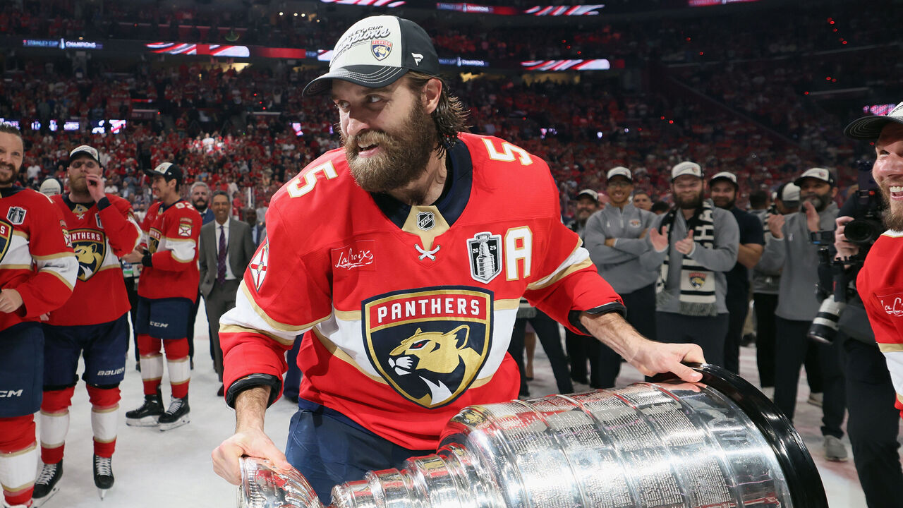 SUNRISE, FLORIDA - JUNE 17: Aaron Ekblad #5 of the Florida Panthers skates with the Stanley Cup following their win over the Edmonton Oilers following Game Six of the 2025 NHL Stanley Cup Final at Amerant Bank Arena on June 17, 2025 in Sunrise, Florida.