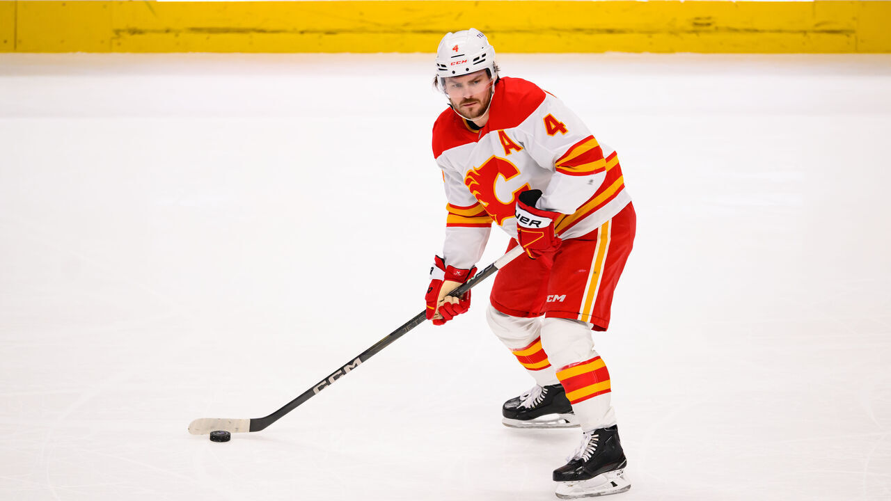 SAN JOSE, CA - APRIL 07: Calgary Flames defenseman Rasmus Andersson (4) passes the puck during a NHL game between the Calgary Flames and the San Jose Sharks on April 07, 2025 at SAP Center in San Jose, CA.