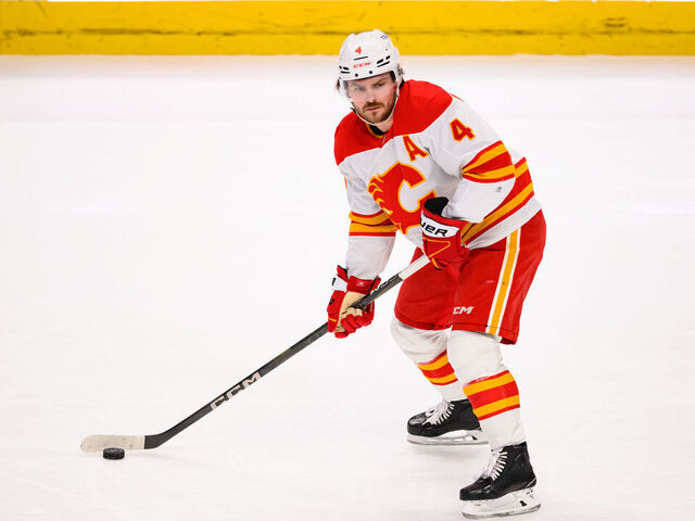 SAN JOSE, CA - APRIL 07: Calgary Flames defenseman Rasmus Andersson (4) passes the puck during a NHL game between the Calgary Flames and the San Jose Sharks on April 07, 2025 at SAP Center in San Jose, CA.