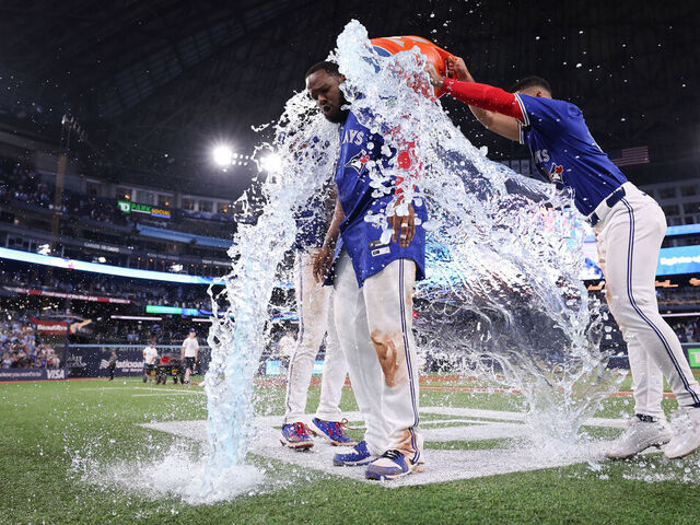 TORONTO, ON - JUNE 30: Vladimir Guerrero Jr. #27 of the Toronto Blue Jays receives a Gatorade bath after winning the game between the New York Yankees and the Toronto Blue Jays at Rogers Centre on Monday, June 30, 2025 in TorontoOntario, Canada.