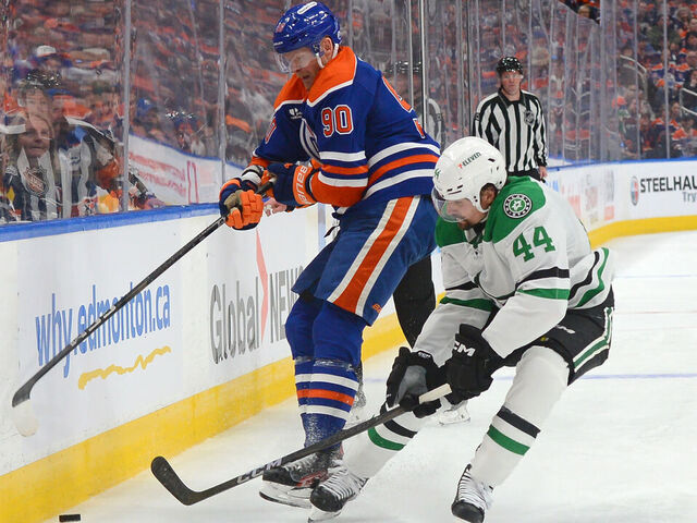 EDMONTON, CANADA - MAY 25: Corey Perry #90 of the Edmonton Oilers battles for the puck against Cody Ceci #44 of the Dallas Stars during the third period of Game Three of the Western Conference Finals of the 2025 Stanley Cup Playoffs at Rogers Place on May 25, 2025, in Edmonton, Alberta, Canada.