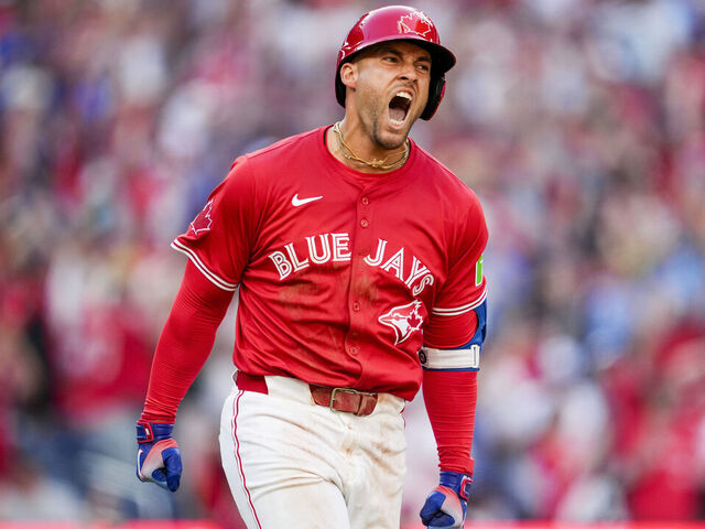 TORONTO, ON - JULY 1: George Springer #4 of the Toronto Blue Jays celebrates his grand slam home run against the New York Yankees during the seventh inning in their MLB game at the Rogers Centre on July 1, 2025 in Toronto, Ontario, Canada.