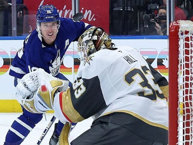 TORONTO, ON- NOVEMBER 20 - A shot by Toronto Maple Leafs right wing Mitch Marner (16) sails just over Vegas Golden Knights goaltender Adin Hill (33) as the Toronto Maple Leafs shutout the Vegas Golden Knights 3-0 at Scotiabank Arena in Toronto. November 20, 2024.