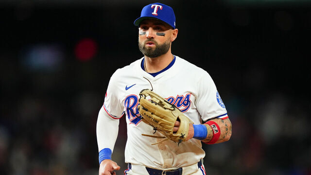 ARLINGTON, TX - APRIL 15: Kevin Pillar #1 of the Texas Rangers leaves the field during the game between the Los Angeles Angels and the Texas Rangers at Globe Life Field on Tuesday, April 15, 2025 in Arlington, Texas.