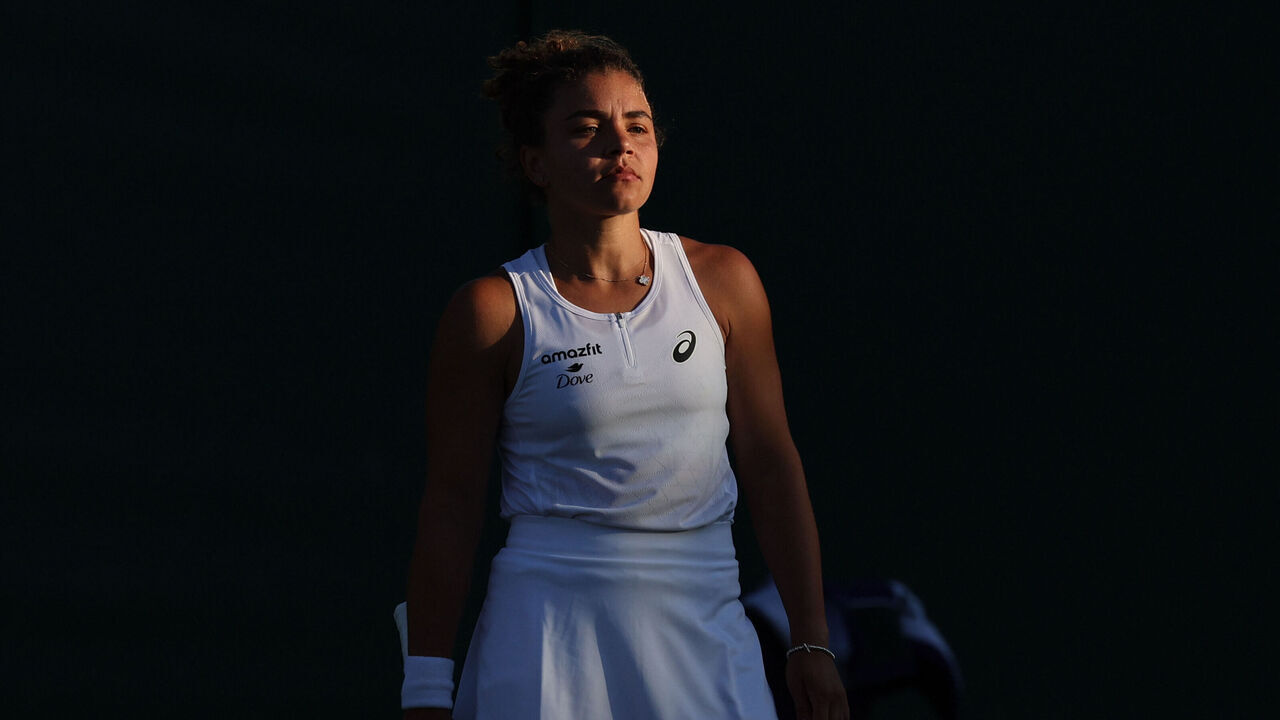 Italy's Jasmine Paolini reacts as she plays against Russia's Kamilla Rakhimova during their women's singles second round tennis match on the third day of the 2025 Wimbledon Championships at The All England Lawn Tennis and Croquet Club in Wimbledon, southwest London, on July 2, 2025.