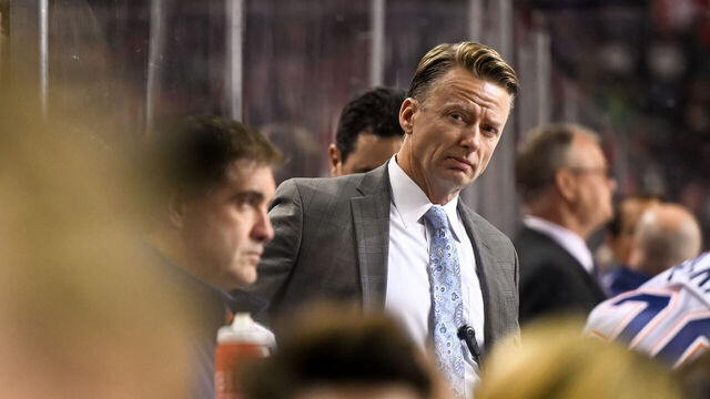 CALGARY, AB - SEPTEMBER 28: Edmonton Oilers assistant coach Glen Gulutzan looks on from the bench during the second period of an NHL pre-season game between the Calgary Flames and the Edmonton Oilers on September 28, 2022, at the Scotiabank Saddledome in Calgary, AB.
