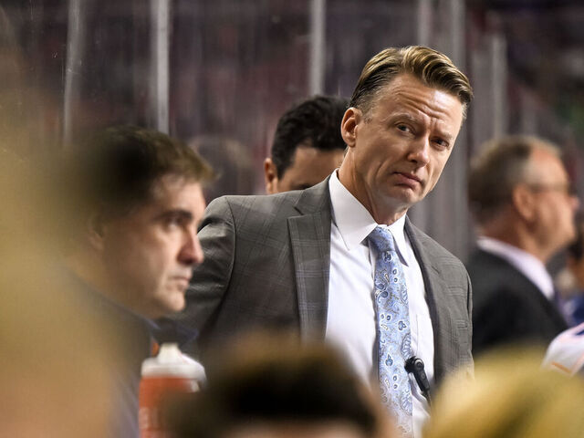 CALGARY, AB - SEPTEMBER 28: Edmonton Oilers assistant coach Glen Gulutzan looks on from the bench during the second period of an NHL pre-season game between the Calgary Flames and the Edmonton Oilers on September 28, 2022, at the Scotiabank Saddledome in Calgary, AB.
