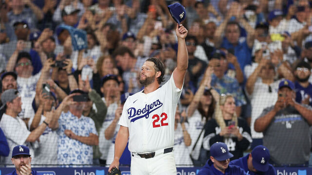 LOS ANGELES, CA - JULY 02: Clayton Kershaw #22 of the Los Angeles Dodgers salutes the crowd after delivering the 3000th strikeout of his career in the sixth inning during the game between the Chicago White Sox and the Los Angeles Dodgers at Dodger Stadium on Wednesday, July 2, 2025 in Los Angeles, California. Kershaw is now the 20th member of the 3,000-strikeout club, and is only the fourth left-handed pitcher to have struck out 3,000 or more batters in their career.