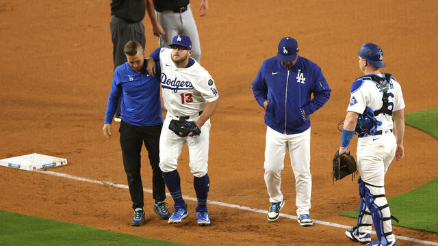 LOS ANGELES, CALIFORNIA - JULY 02: Max Muncy #13 of the Los Angeles Dodgers reacts as he is helped off the field by the trainer after being injured during the sixth inning against the Chicago White Sox at Dodger Stadium on July 02, 2025 in Los Angeles, California.
