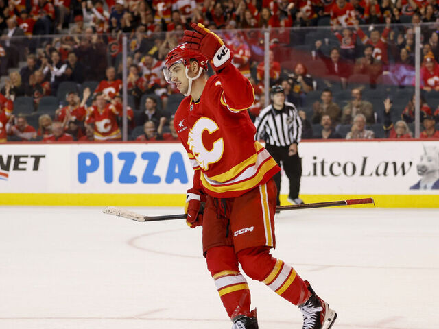 CALGARY, CANADA - APRIL 15: Morgan Frost #16 of the Calgary Flames celebrates his overtime goal against the Vegas Golden Knights at the Scotiabank Saddledome on April 15, 2025, in Calgary, Alberta, Canada.