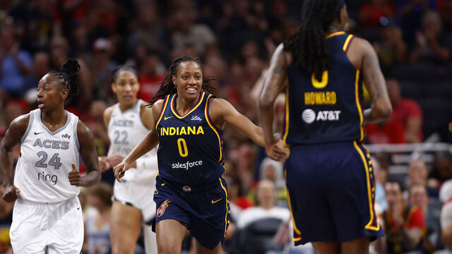 INDIANAPOLIS, IN - JULY 03: Indiana Fever guard Kelsey Mitchell (0) is all smiles after dishing the assist to /f9/durning a WNBA game between the Las Vegas Aces and the Indiana Fever on July 03,2025 at Gainbridge Fieldhouse in Indianapolis, IN.