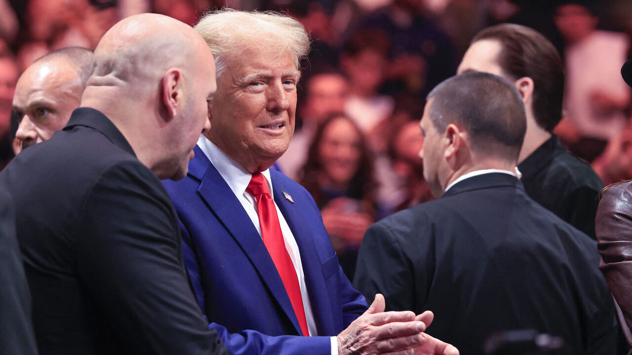 US President-elect Donald Trump next to CEO of Ultimate Fighting Championship Dana White (L), attend UFC 309 at Madison Square Garden in New York, on November 16, 2024. US President-elect Donald Trump was greeted by chanting fans as he attended the Ultimate Fighting Championship heavyweight bout at New York's Madison Square Garden on November 16. Trump entered the arena shortly before the start of the main card accompanied by UFC chief executive Dana White, who was a prominent backer during his election campaign. Several political allies of Trump were also in attendance including entrepreneurs Elon Musk and Vivek Ramaswamy, who have been asked by Trump to lead efforts to cut government inefficiency.