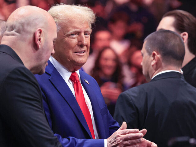 US President-elect Donald Trump next to CEO of Ultimate Fighting Championship Dana White (L), attend UFC 309 at Madison Square Garden in New York, on November 16, 2024. US President-elect Donald Trump was greeted by chanting fans as he attended the Ultimate Fighting Championship heavyweight bout at New York's Madison Square Garden on November 16. Trump entered the arena shortly before the start of the main card accompanied by UFC chief executive Dana White, who was a prominent backer during his election campaign. Several political allies of Trump were also in attendance including entrepreneurs Elon Musk and Vivek Ramaswamy, who have been asked by Trump to lead efforts to cut government inefficiency.