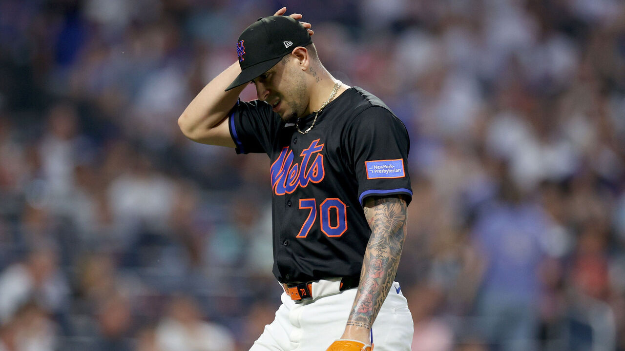 NEW YORK, NEW YORK - JUNE 23: Jose Butto #70 of the New York Mets walks back to the dugout in the fifth inning during the game against the Atlanta Braves at Citi Field on June 23, 2025 in New York City.