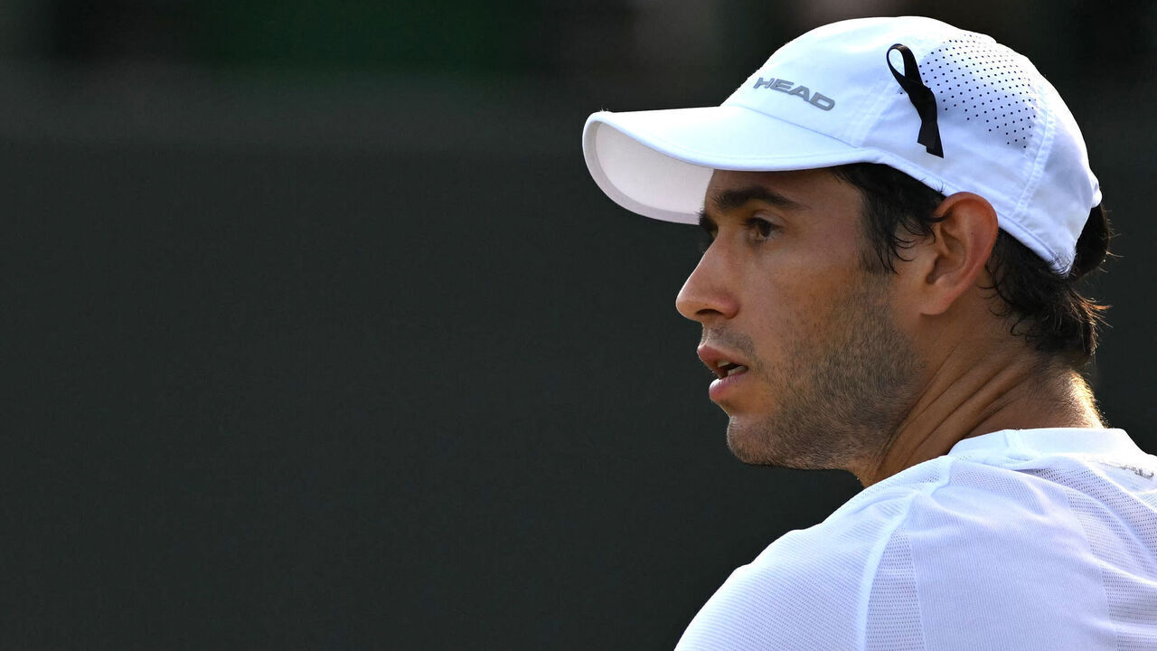 Portugal's Nuno Borges wears a black ribbon in tribute to late Portuguese football player Diogo Jota during during his men's singles third round tennis match against Russia's Karen Khachanov on the fifth day of the 2025 Wimbledon Championships at The All England Lawn Tennis and Croquet Club in Wimbledon, southwest London, on July 4, 2025. Liverpool forward Diogo Jota and his brother Andre Silva died in a car crash in northwestern Spain early July 3, sparking widespread grief just after the Portugal star had got married.