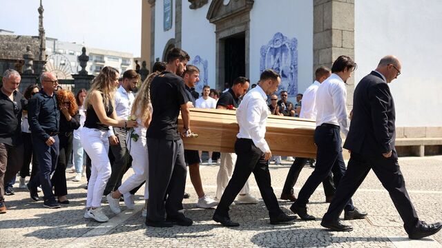 Diogo Jota's parents (L) follow the coffin of Portuguese football player Diogo Jota carried out of the church after the funeral ceremony of Liverpool's Portuguese forward Diogo Jota and his brother Andre Silva at the Mother Church of Gondomar, on the outskirts of Porto, on July 5, 2025. Liverpool forward Diogo Jota and his brother died in a car crash in Spain on July 3, 2025, sparking widespread grief just after the Portugal star had got married.